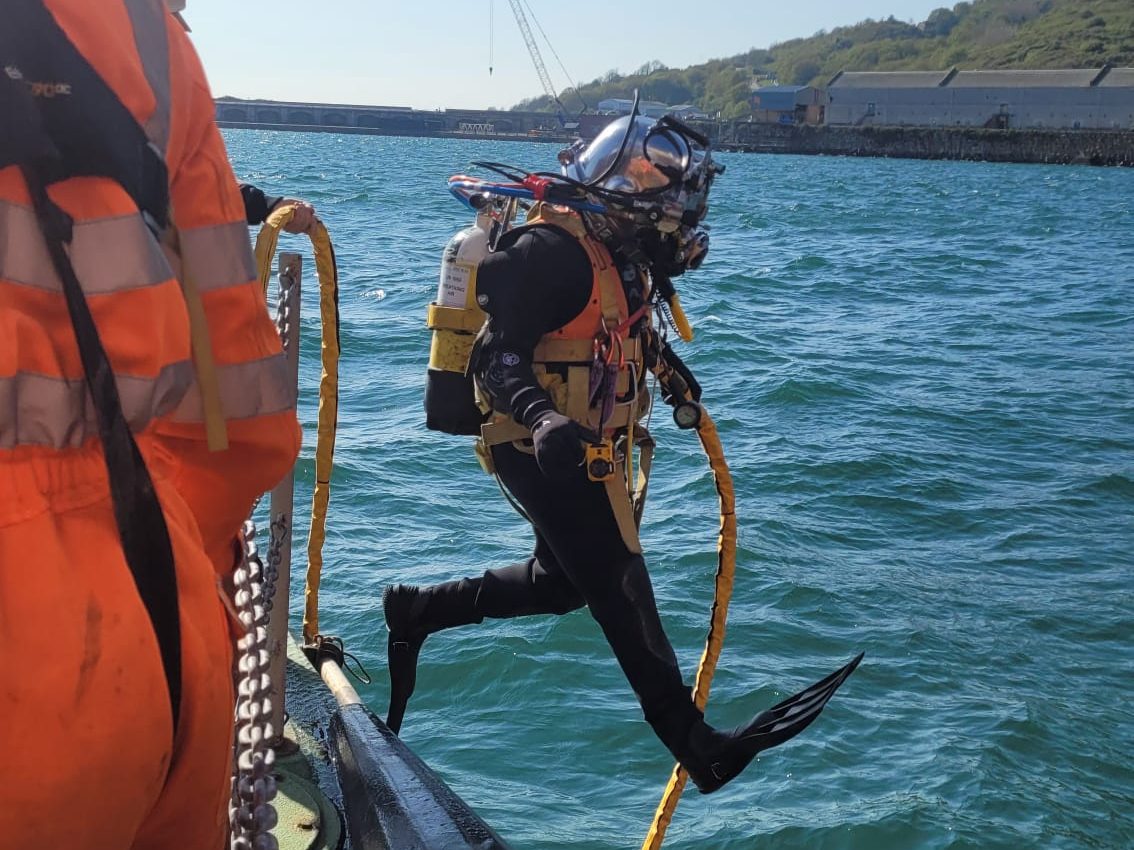 class in-water surveys UK a diver enters the water