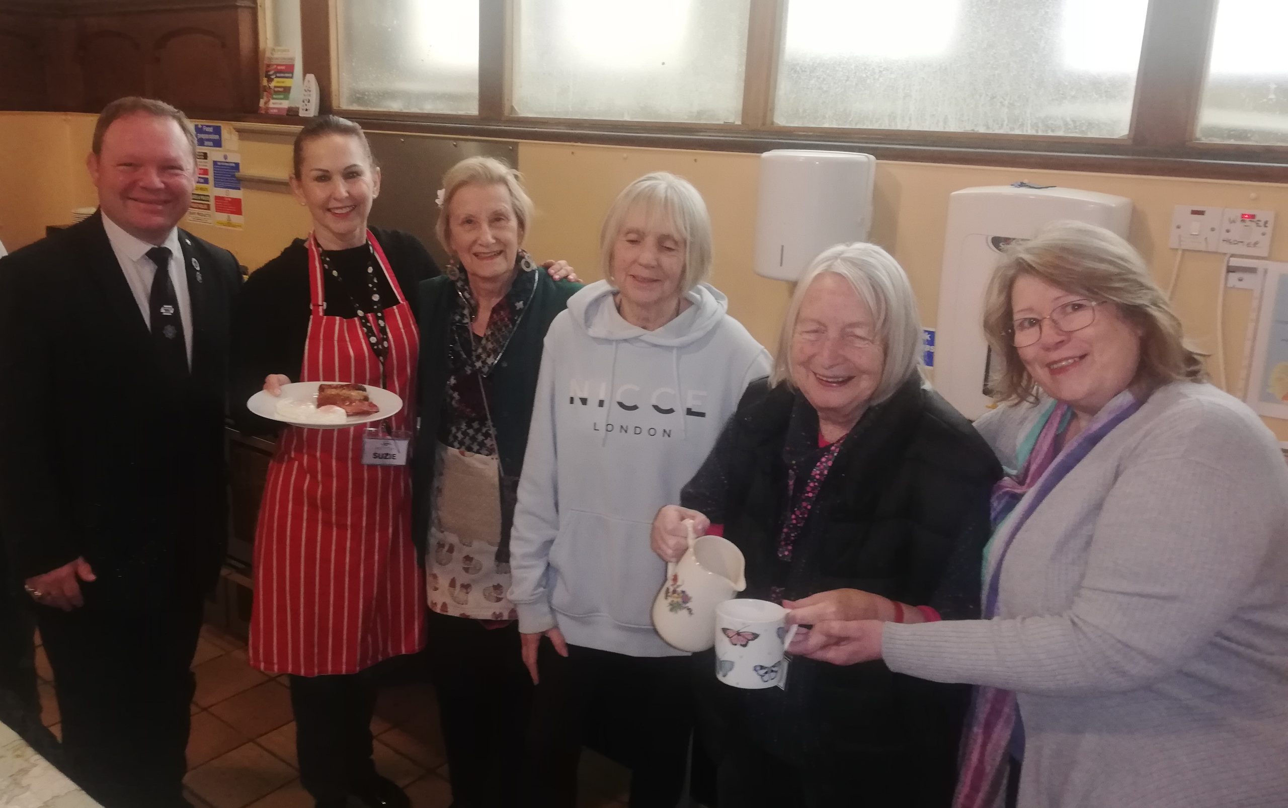 HUG Team volunteers serving food